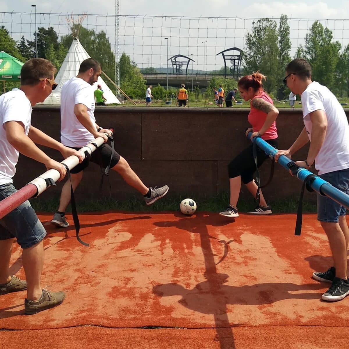 People playing human table football in Prague